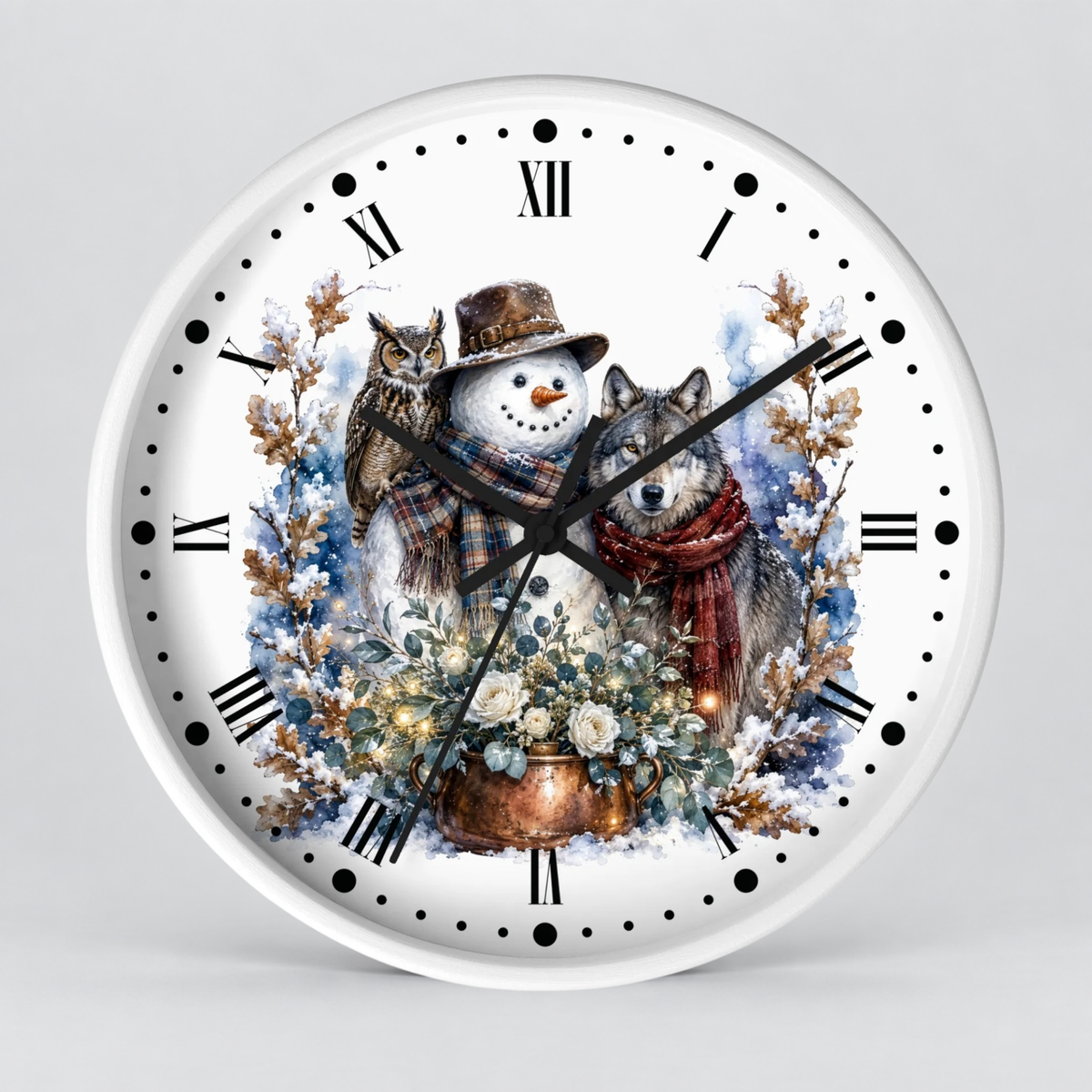 A round white wall clock with a detailed winter illustration on the face, featuring a snowman, owl, wolf, flowers, and blue watercolor washes. The clock has black Roman numerals and black hands and is photographed against a neutral light gray background.