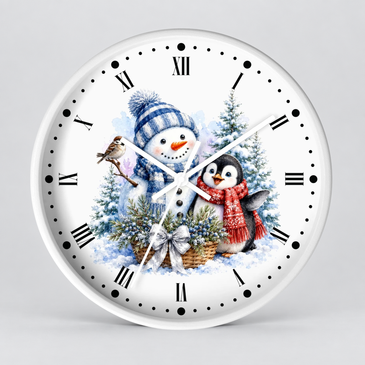 A round white wall clock with black Roman numerals and black hour markers, featuring a winter holiday illustration on the face with a snowman in a blue striped hat, a penguin in a red scarf, evergreen trees, and a small bird.