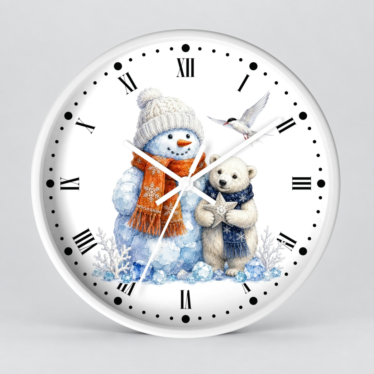 A round white wall clock with a winter illustration on the face, featuring a snowman in a beige hat and orange scarf, a polar bear in a blue scarf, and a small bird. The clock has black Roman numerals and black dot hour markers on a light gray background.