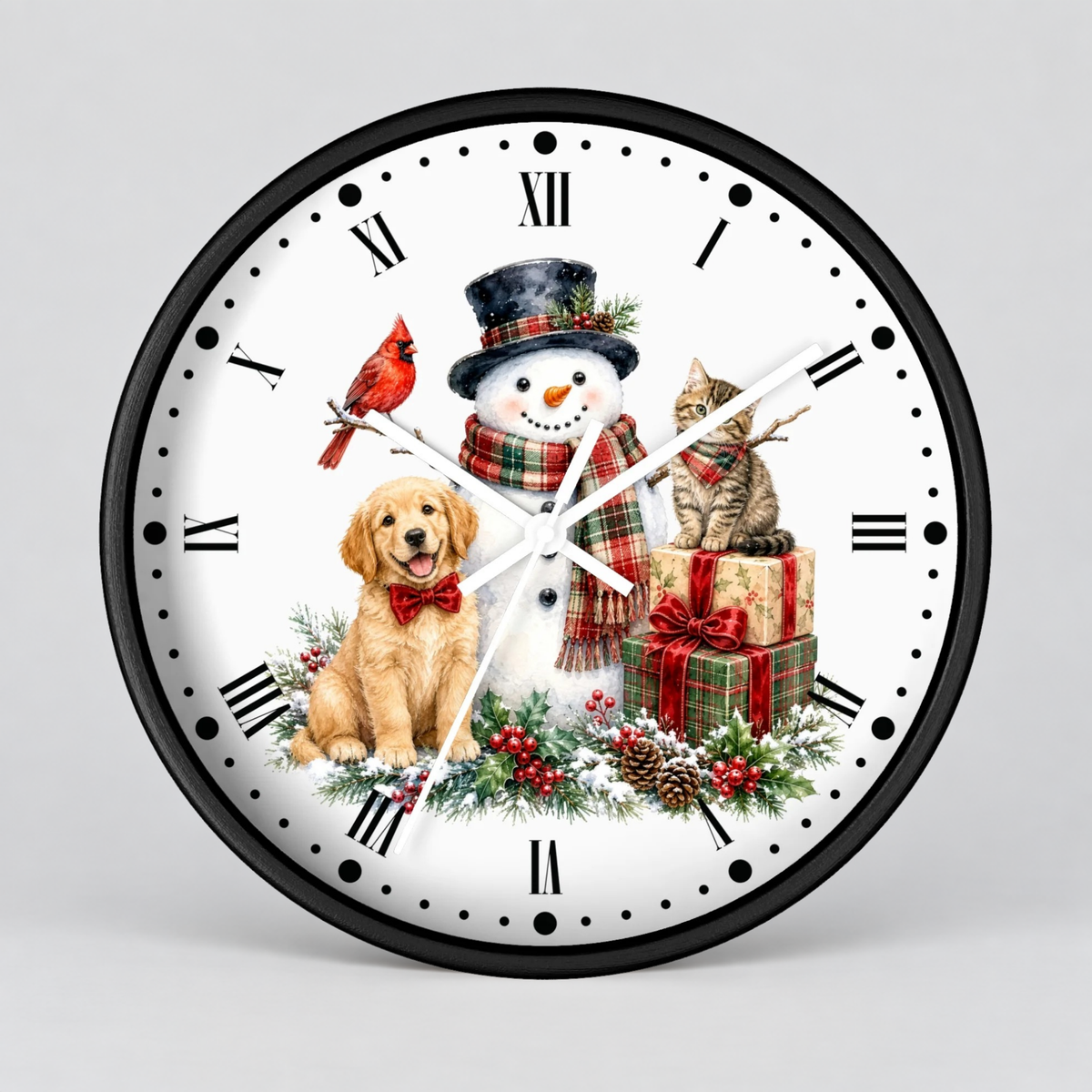 A round wall clock with a black frame and white face, featuring a festive Christmas illustration with a snowman, golden retriever dog, red cardinal, tabby cat, wrapped gifts, pinecones, and holly. The clock is shown against a neutral light gray background.