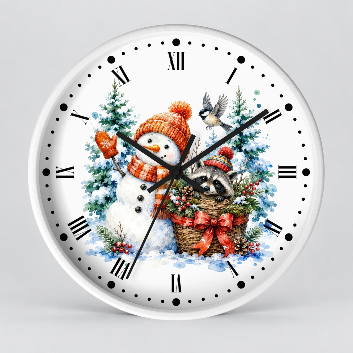 A round white wall clock with a festive winter illustration on the face, featuring a snowman in an orange knit hat and scarf, a raccoon in a basket, evergreen trees, and black Roman numerals and hands on a light gray background.