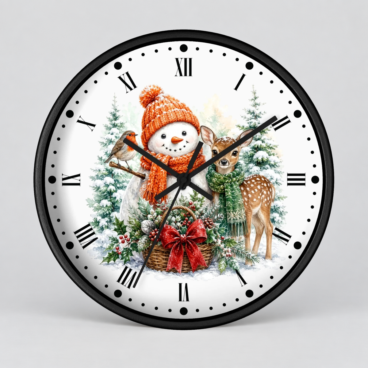 A round wall clock with a black frame and a white face featuring a festive Christmas illustration. The design includes a snowman in an orange knit hat and scarf, a robin, a deer, evergreen trees, and a basket with a red bow.