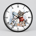 A round wall clock with a black frame and a white face featuring a winter illustration of a wolf, snowman, bird, and small mouse around wooden blocks spelling 'JOY'. The clock is shown against a light gray background.