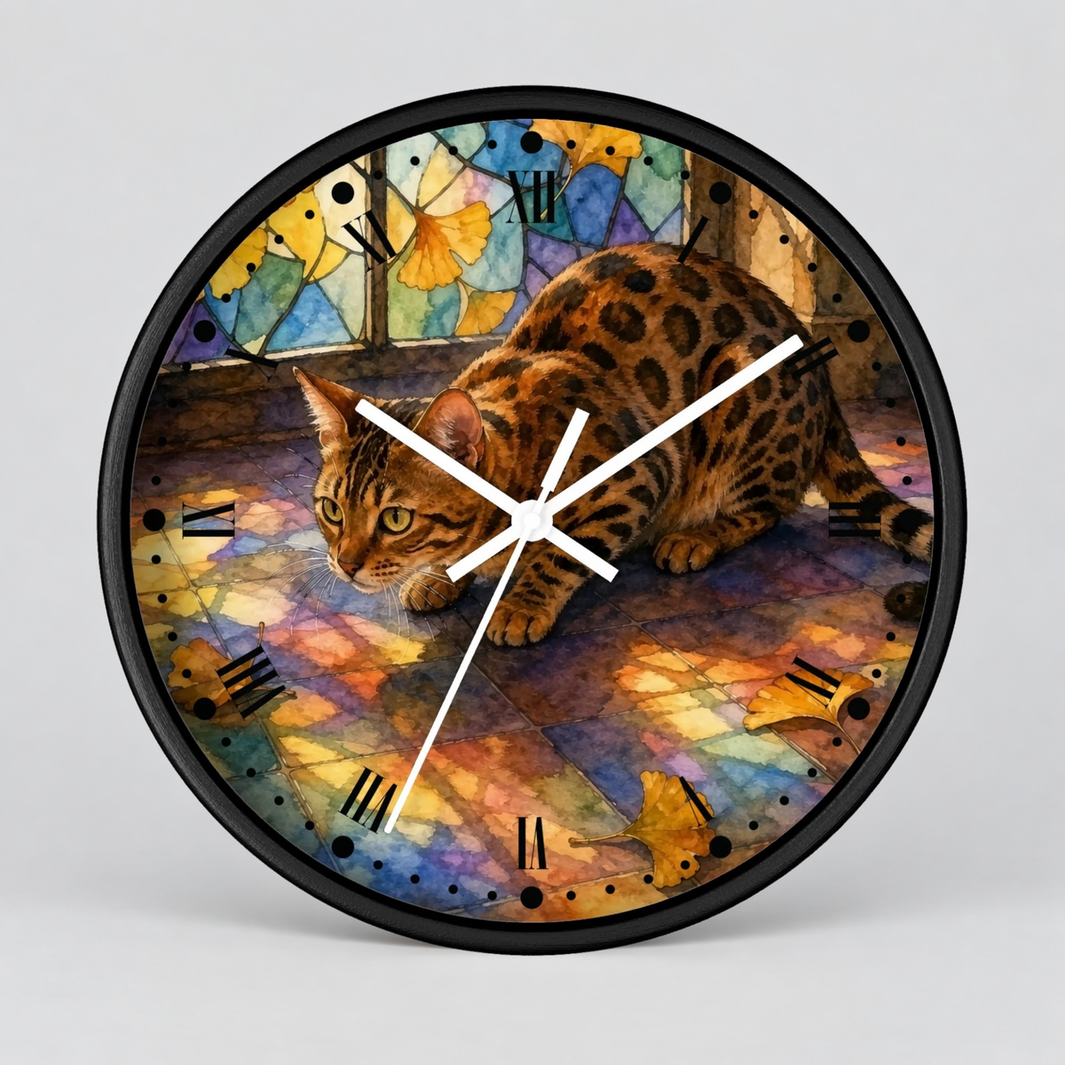 A round wall clock with a black frame and a colorful printed face showing a spotted cat in a stained-glass style scene. The clock is photographed against a light gray studio background.