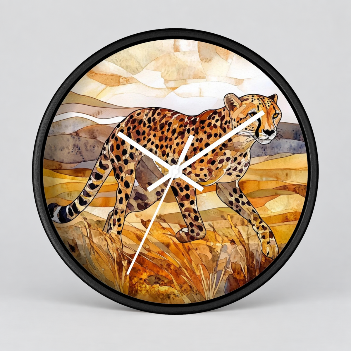 Round wall clock with a black frame and a watercolor-style illustration of a cheetah walking across a warm-toned landscape. The clock hands are white, and the background is a clean light gray studio backdrop.