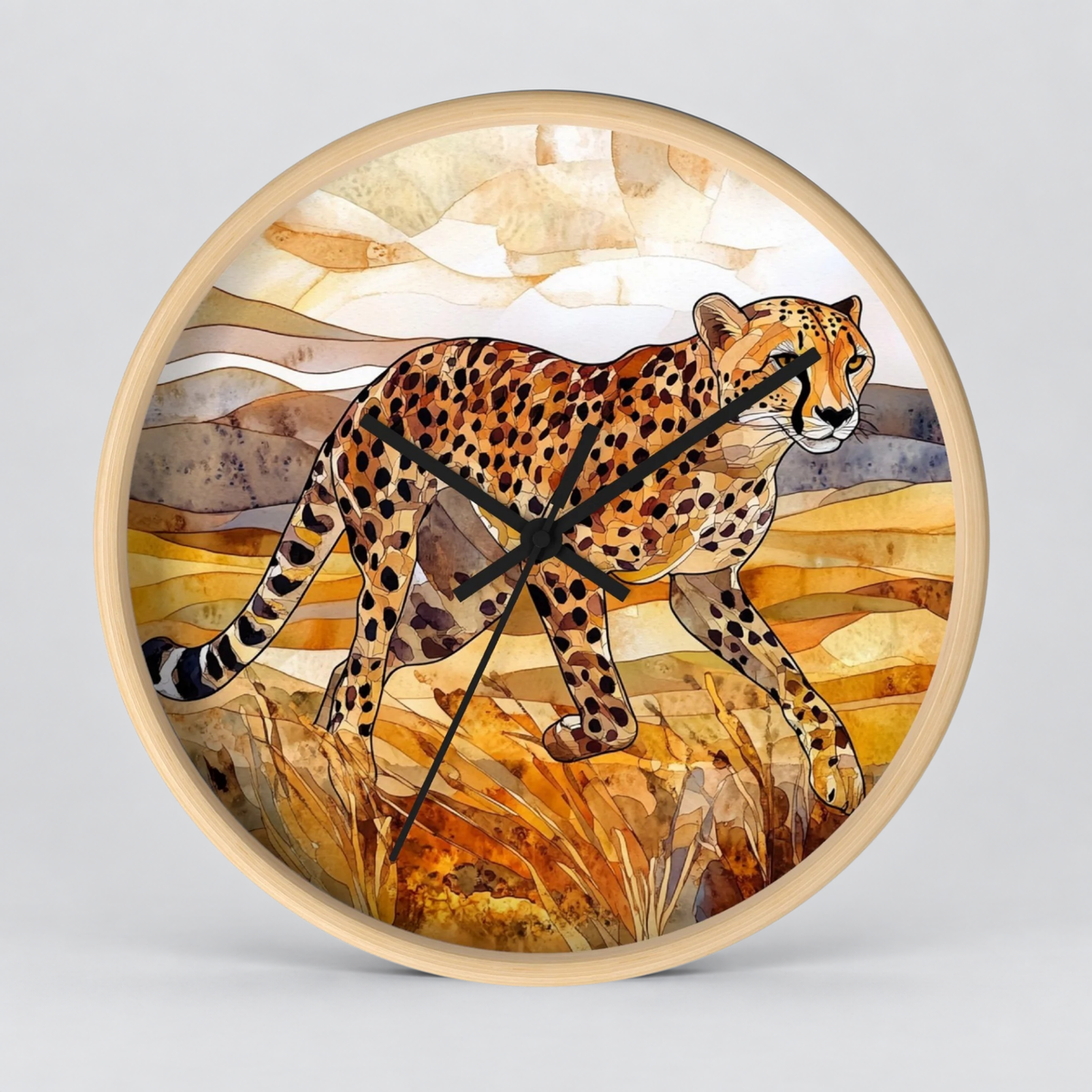 Round wall clock with a light natural wood frame and a watercolor-style illustration of a cheetah walking across a warm-toned savanna landscape. The clock hands are black and there are no visible numbers or brand markings.
