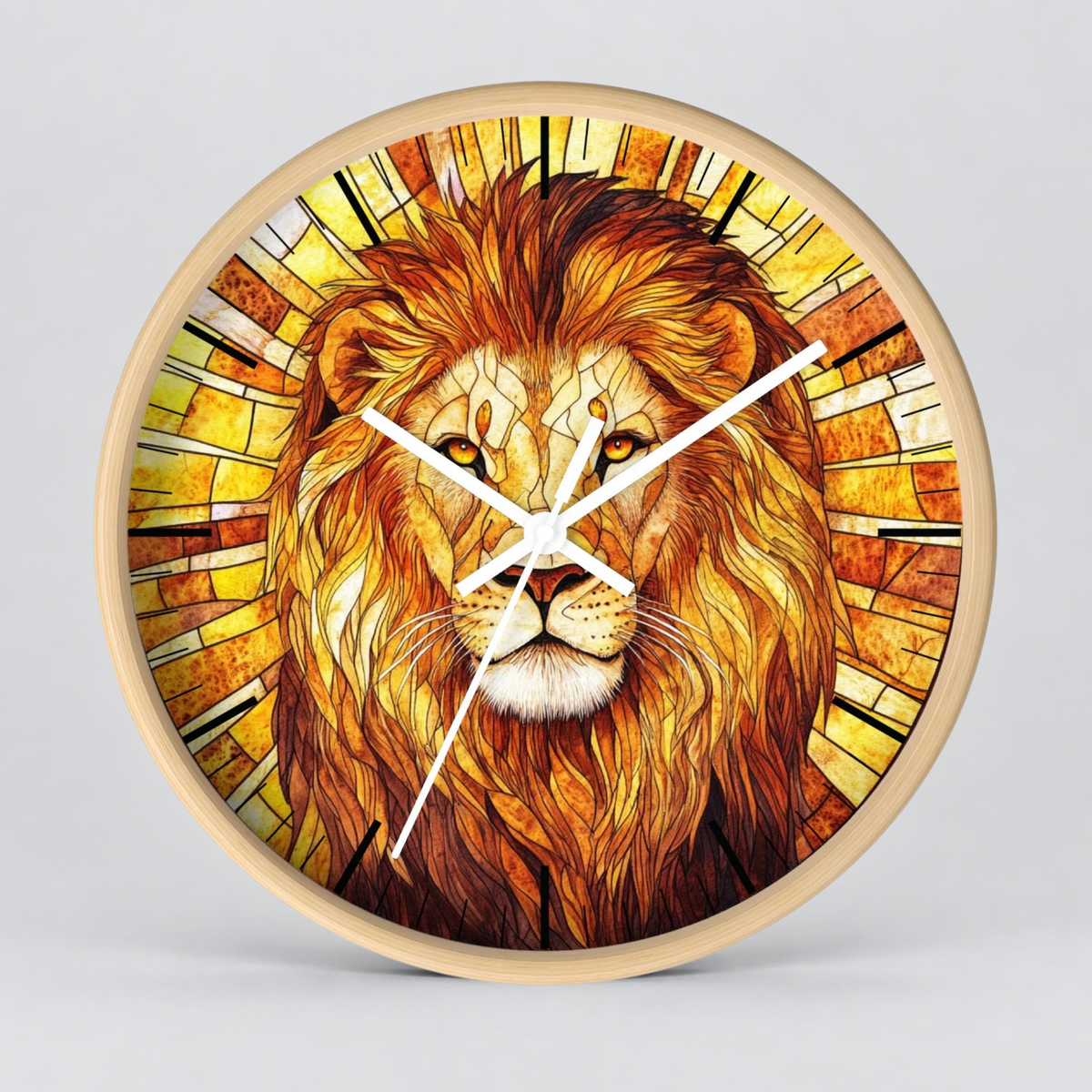 Round wall clock with a light natural wood frame and a detailed stained-glass style illustration of a lion's face in warm golden, orange, and brown tones. The clock has white hands and no visible brand markings, set against a neutral light gray background.