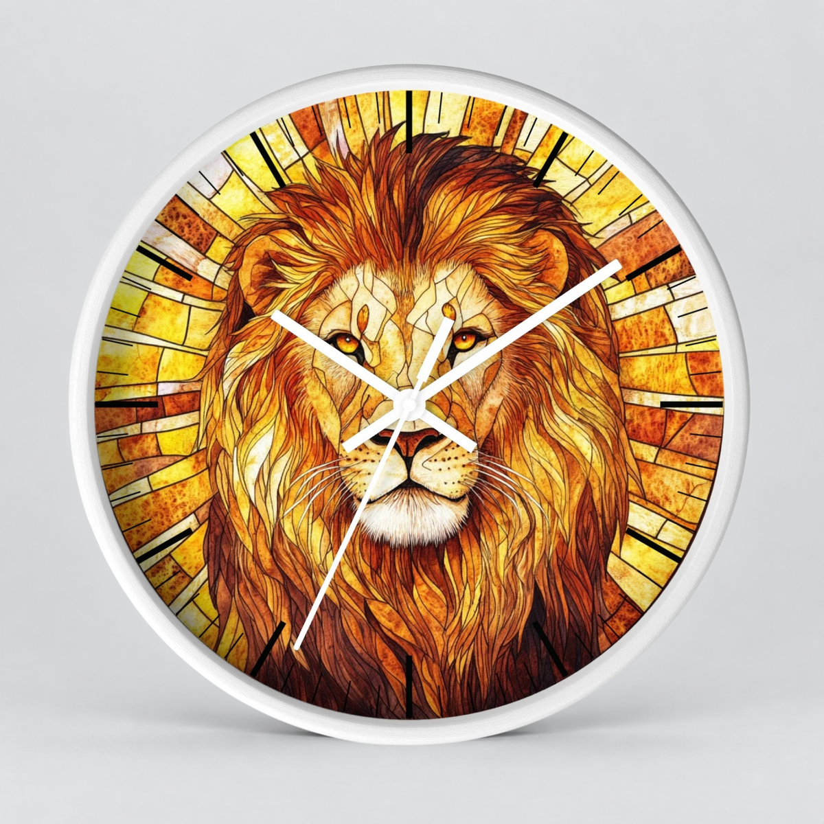 Round wall clock with a white frame and a stained-glass-style lion face illustration in warm yellow, orange, and brown tones, shown against a light gray background.