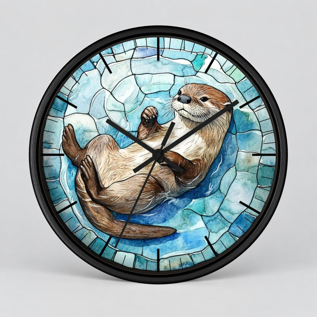 Round wall clock with a black frame and a stained-glass-style illustration of an otter floating on blue water, shown against a light gray background.