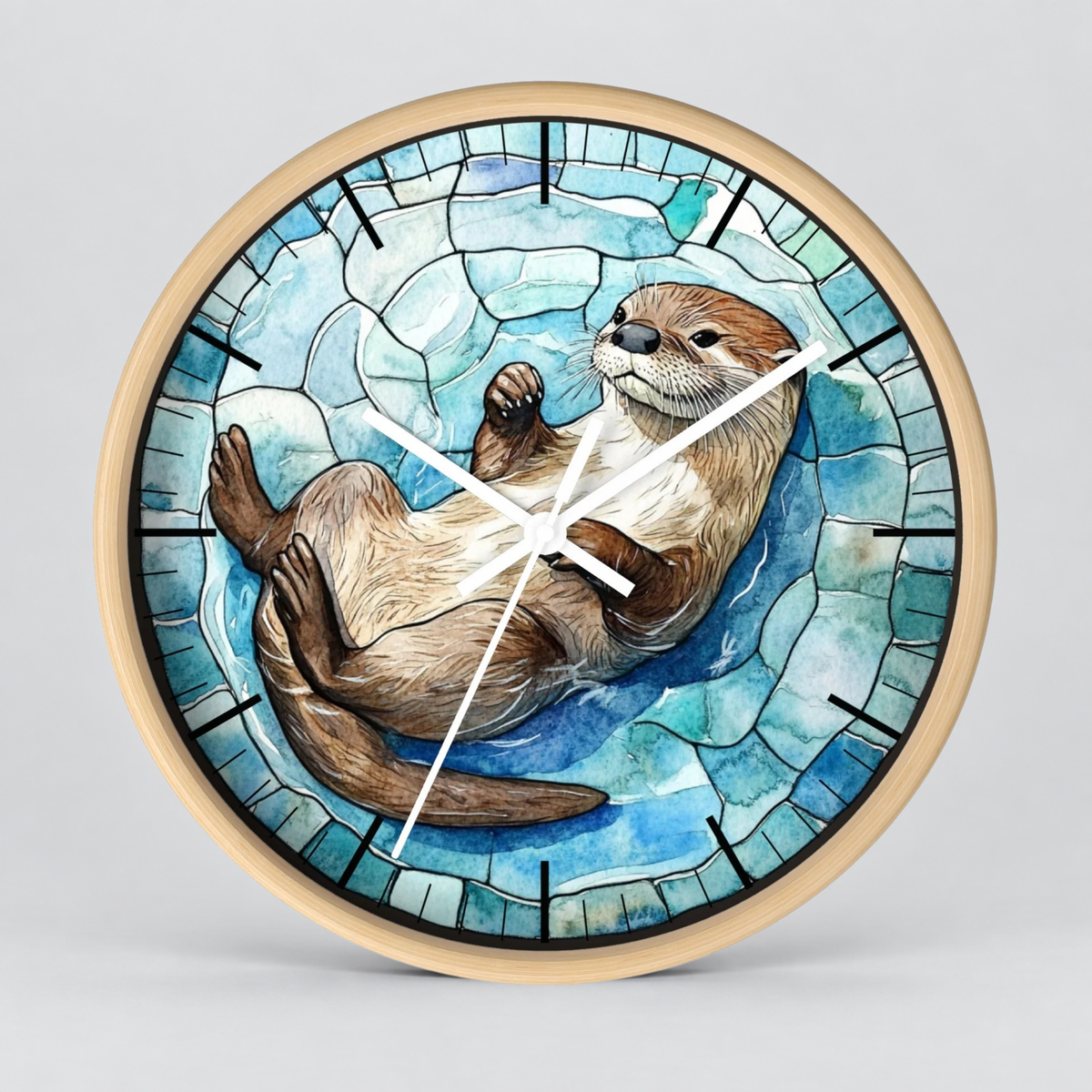 Round wall clock with a light wood frame and a stained-glass-style illustration of an otter floating on blue water, shown against a light gray background.