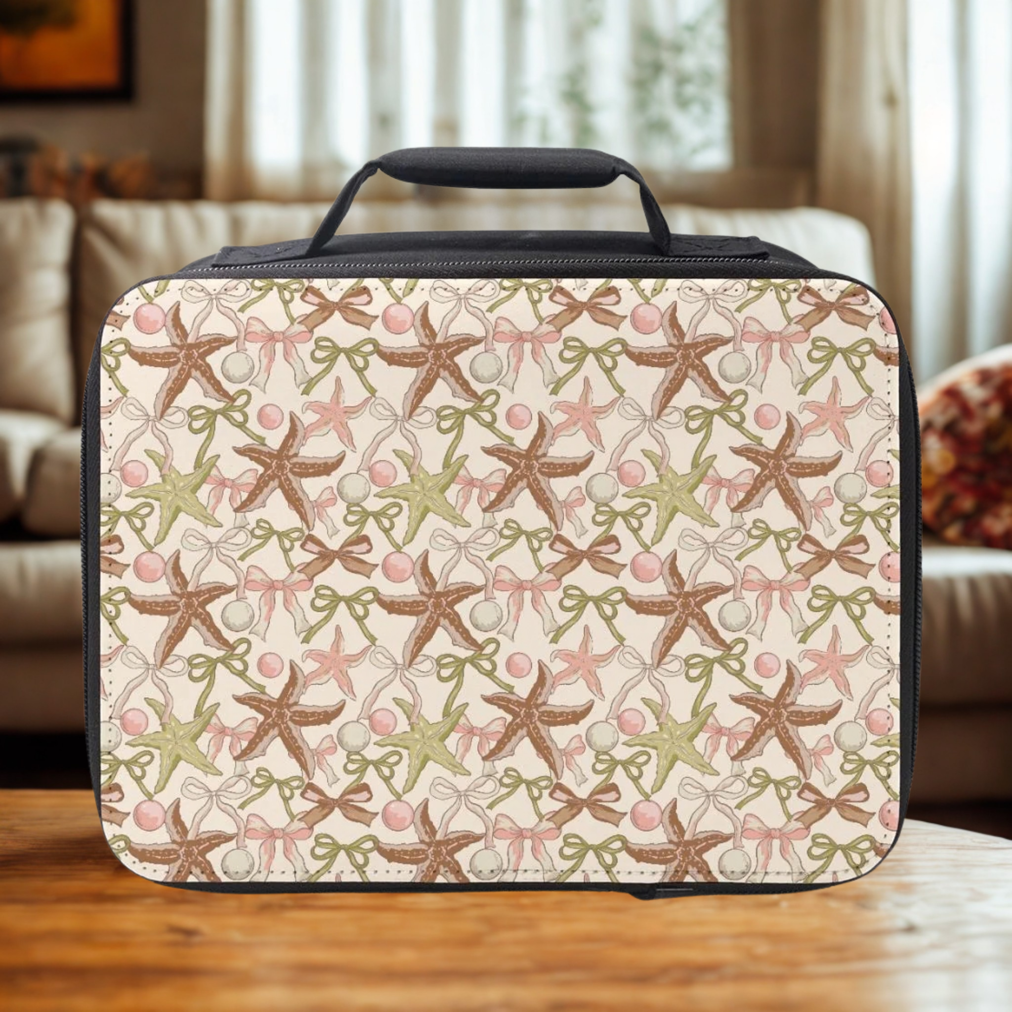 Rectangular lunch bag with starfish and bow pattern on a wooden table in a cozy living room.