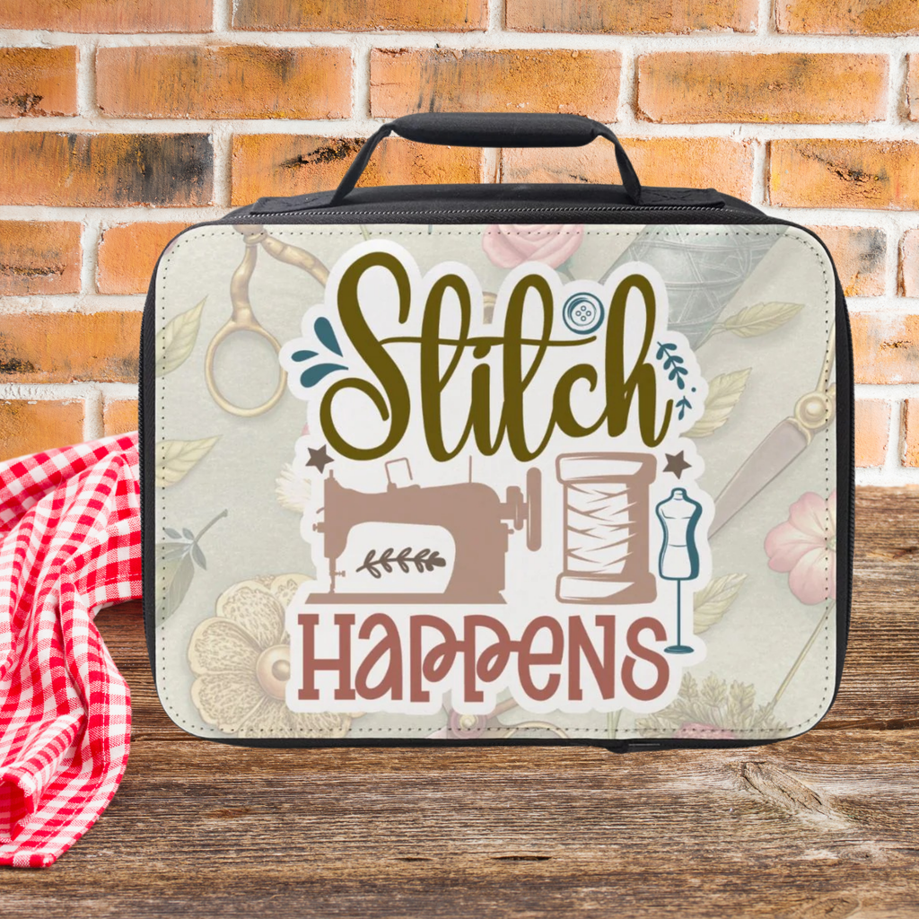 Sewing-themed insulated lunch bag with 'Stitch Happens' text on a wooden picnic table against a brick wall background