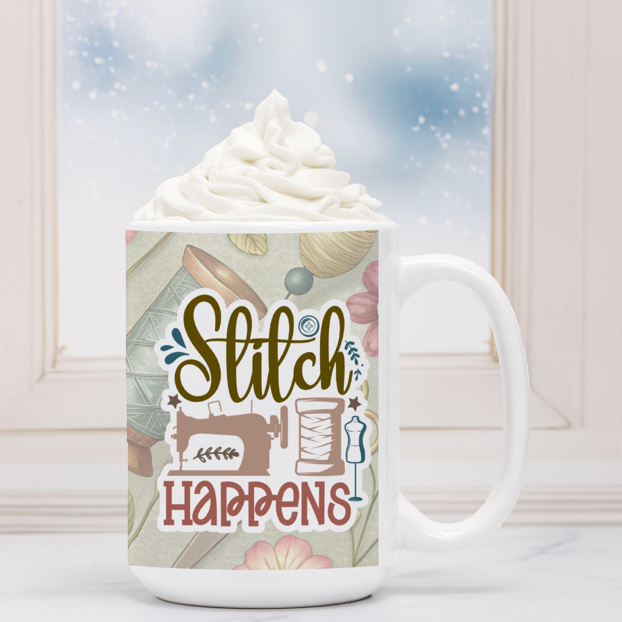 Mug with 'Stitch Happens' design featuring sewing-themed graphics, filled with hot chocolate and whipped cream.