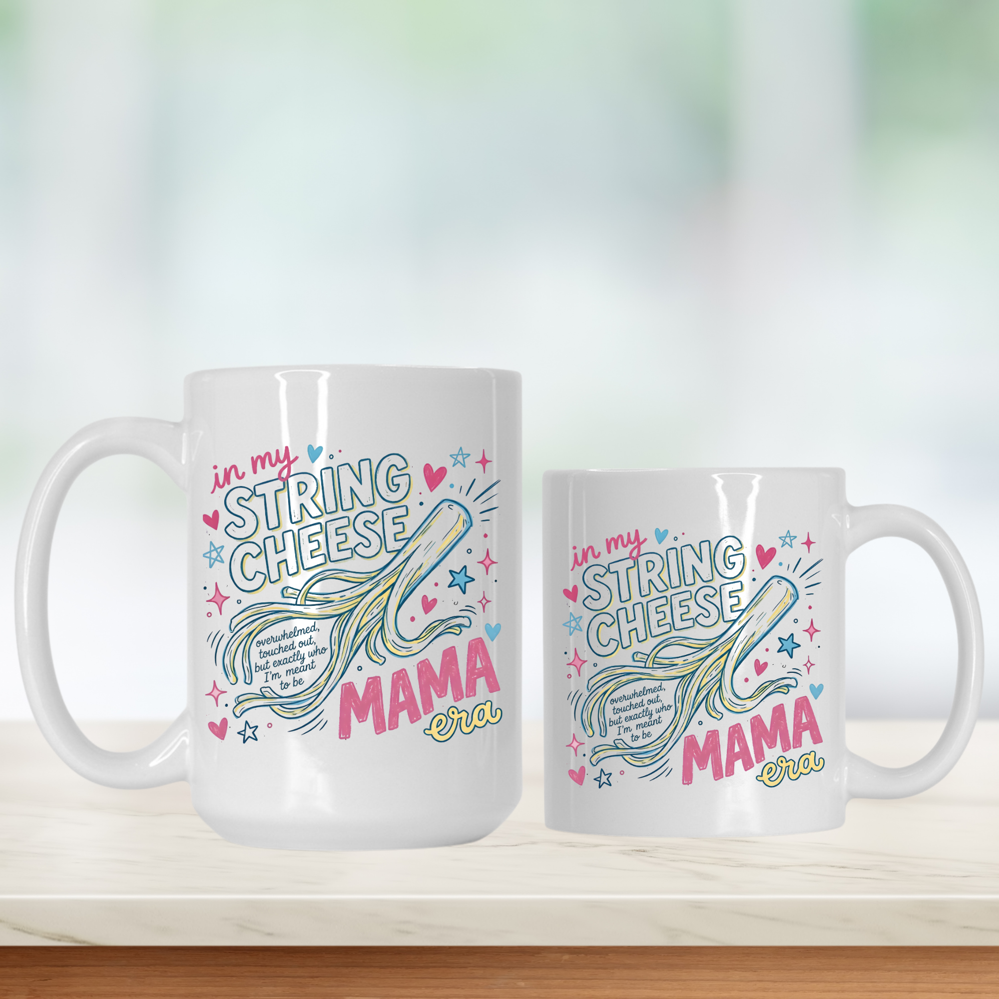 Two white mugs with colorful text 'in my String Cheese Mama era' and graphics on a blurred background
