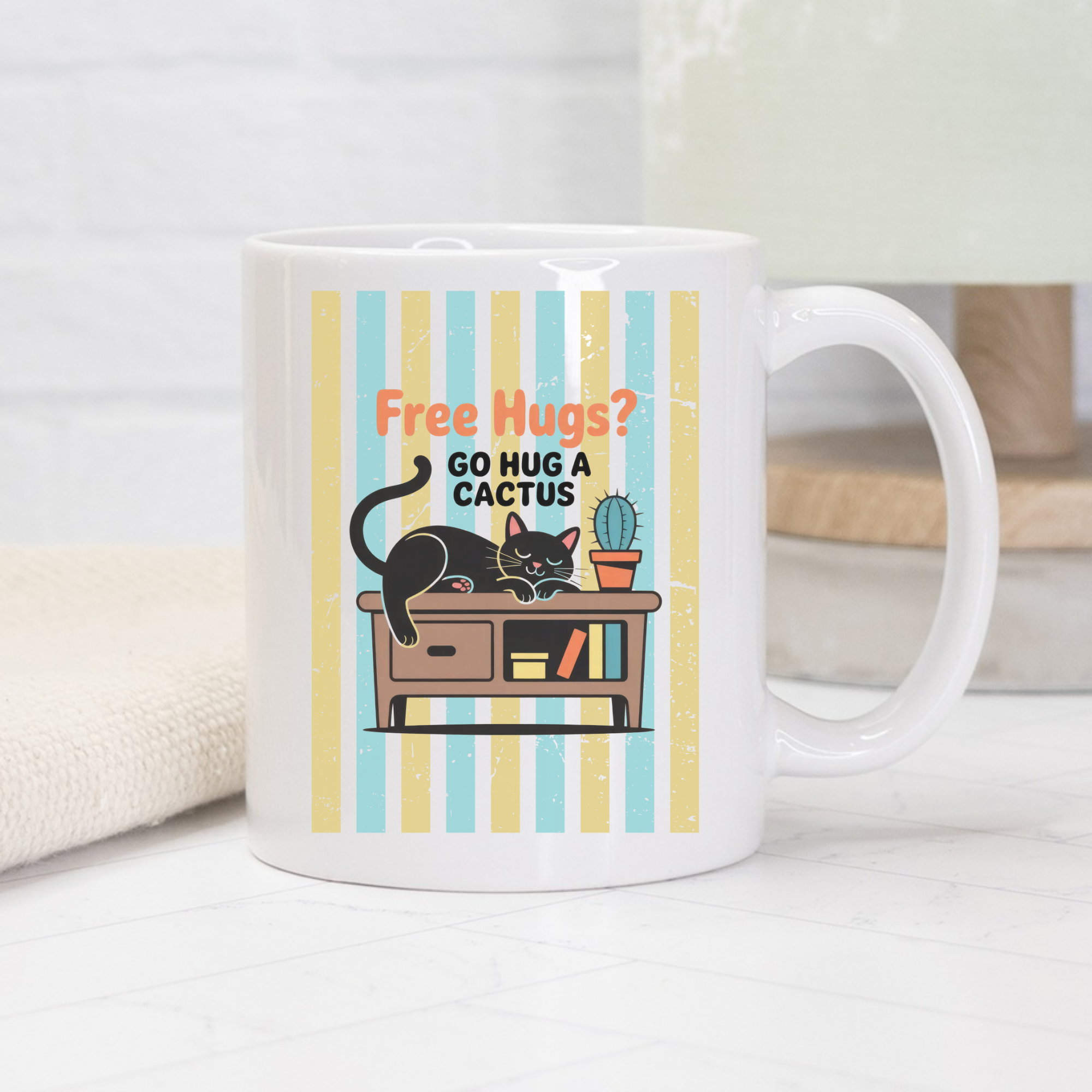 White mug with a cat and cactus design and text on a white background