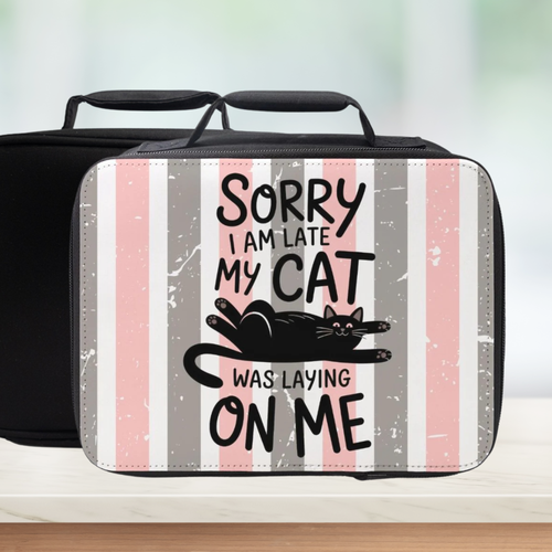 Black lunch bag with a cat-themed message on a striped background
