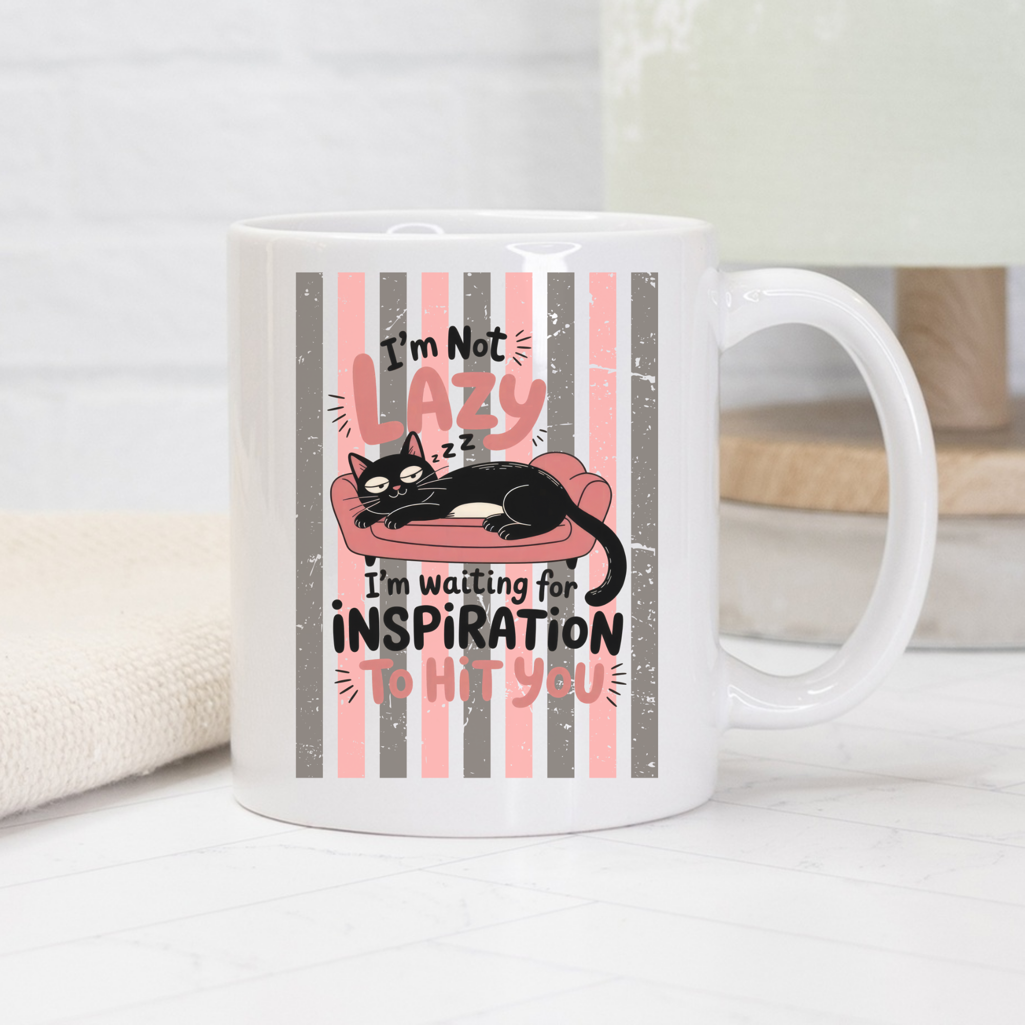 Mug with a cat design and text on a white surface