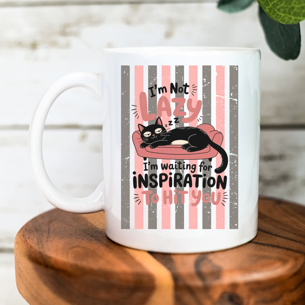 White mug with a black cat graphic and text on a wooden surface
