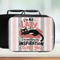 Black lunch bag with a cat graphic and text on a striped background