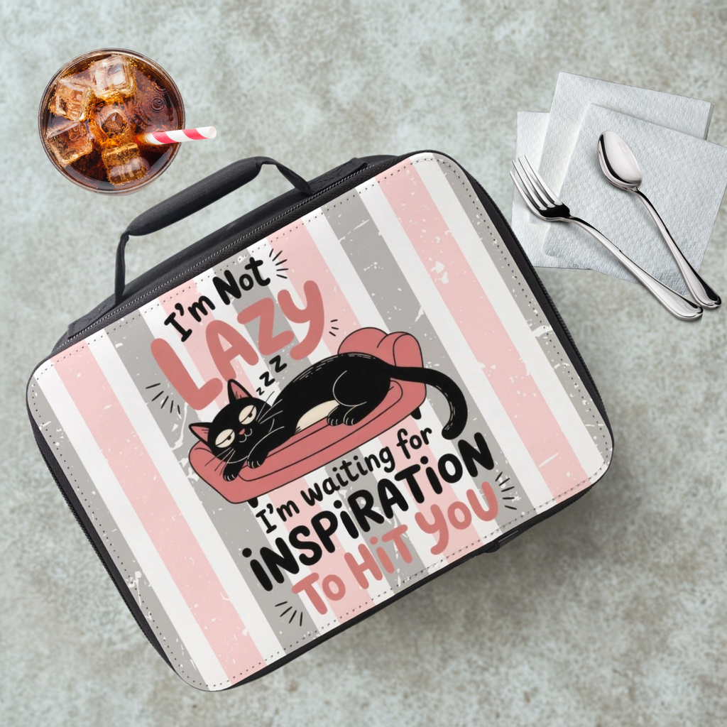 Lunch bag with a cat design and text on a cafeteria table with a drink and utensils.