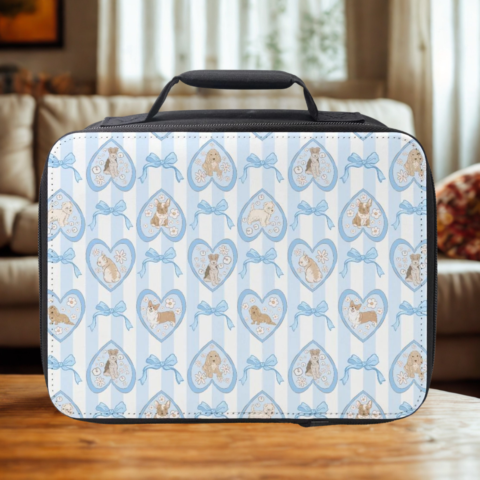 Patterned lunch bag with hearts, dogs, and bows on a wooden living room table