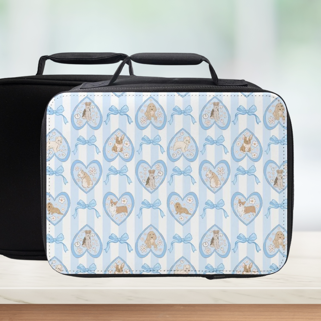 Lunch bag with a pattern of hearts, dogs, and bows on a blue striped background