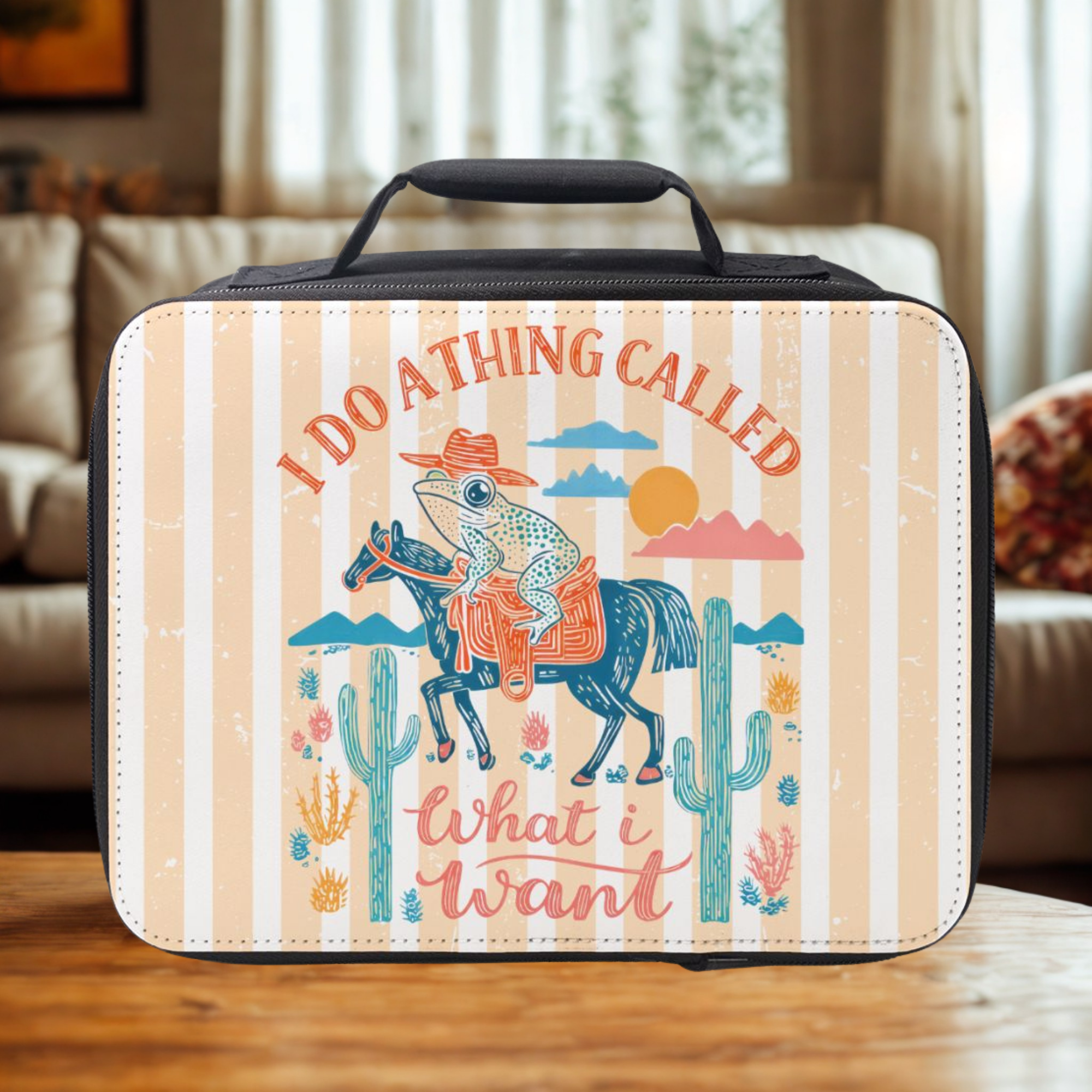  insulated lunch bag with a frog on a horse design and text 'I do a thing called what I want' on a striped background.