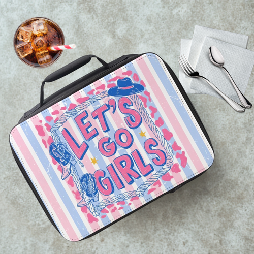 Lunch bag with a pink and blue striped design and 'Let's Go Girls' text on a table with a drink and utensils.