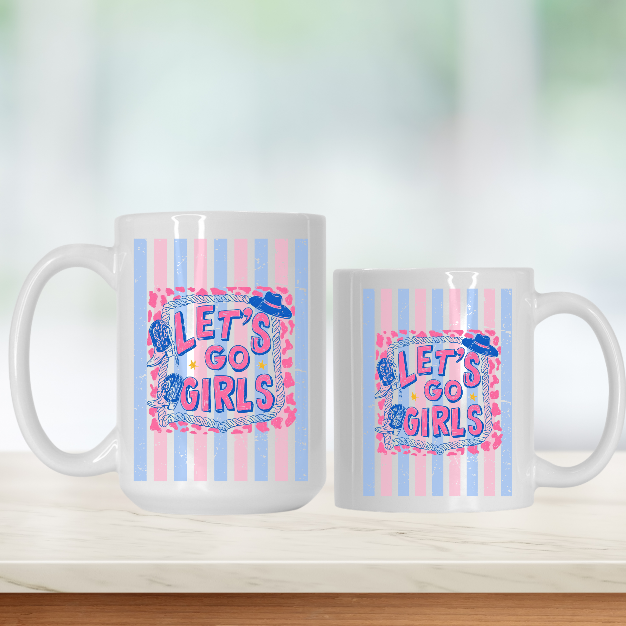 15oz. & 11oz. mugs with trendy striped 'Let's Go Girls' design on a white surface with a blurred background