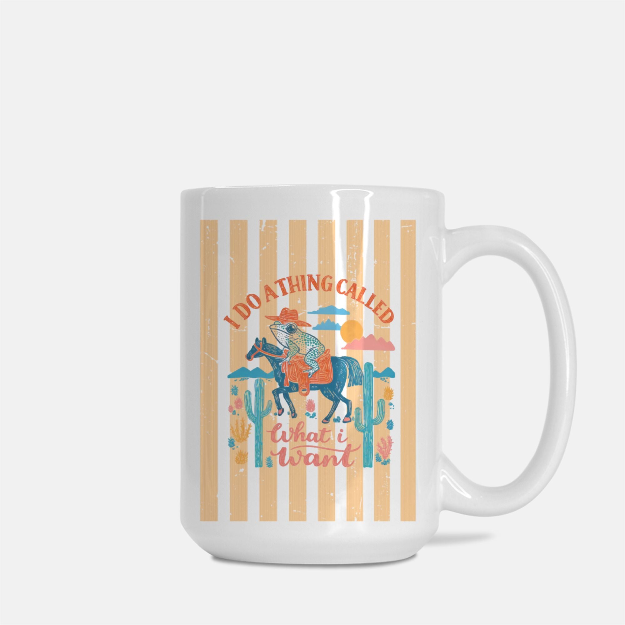 Mug with a graphic design of a person on horseback, cacti, and text on a striped background.