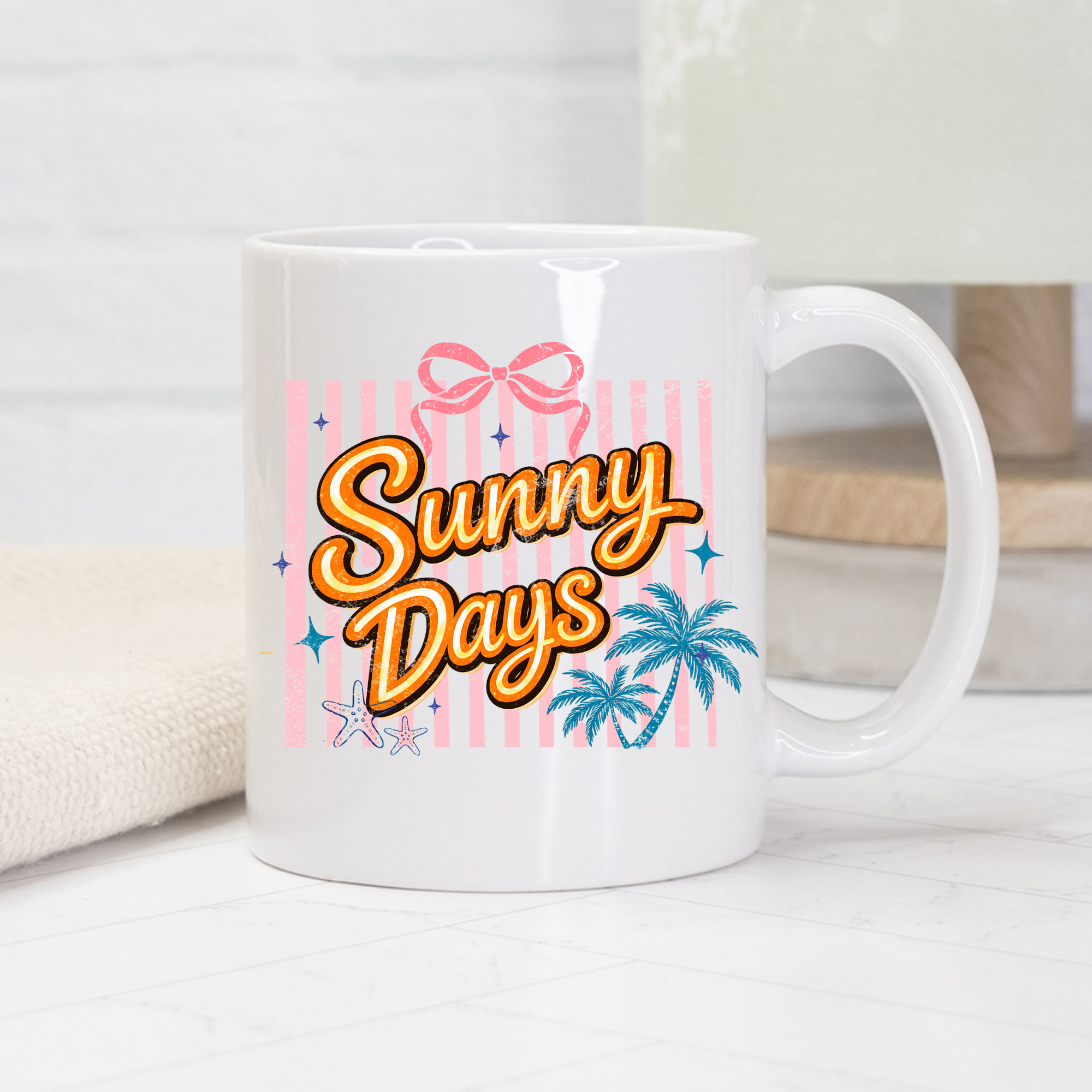 White 11oz. mug with 'Sunny Days' text and decorative elements on a light background