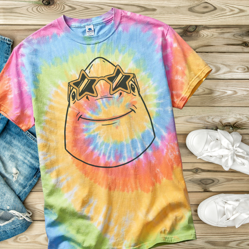 Colorful tie-dye t-shirt with a cartoon character on a wooden surface.