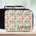 black lunch bag with a cute desert theme and personalized with a name on a counter with a light background.