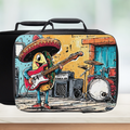 insulated lunch bag with cartoon character tac playing guitar and wearing a sombrero on a counter with a light background