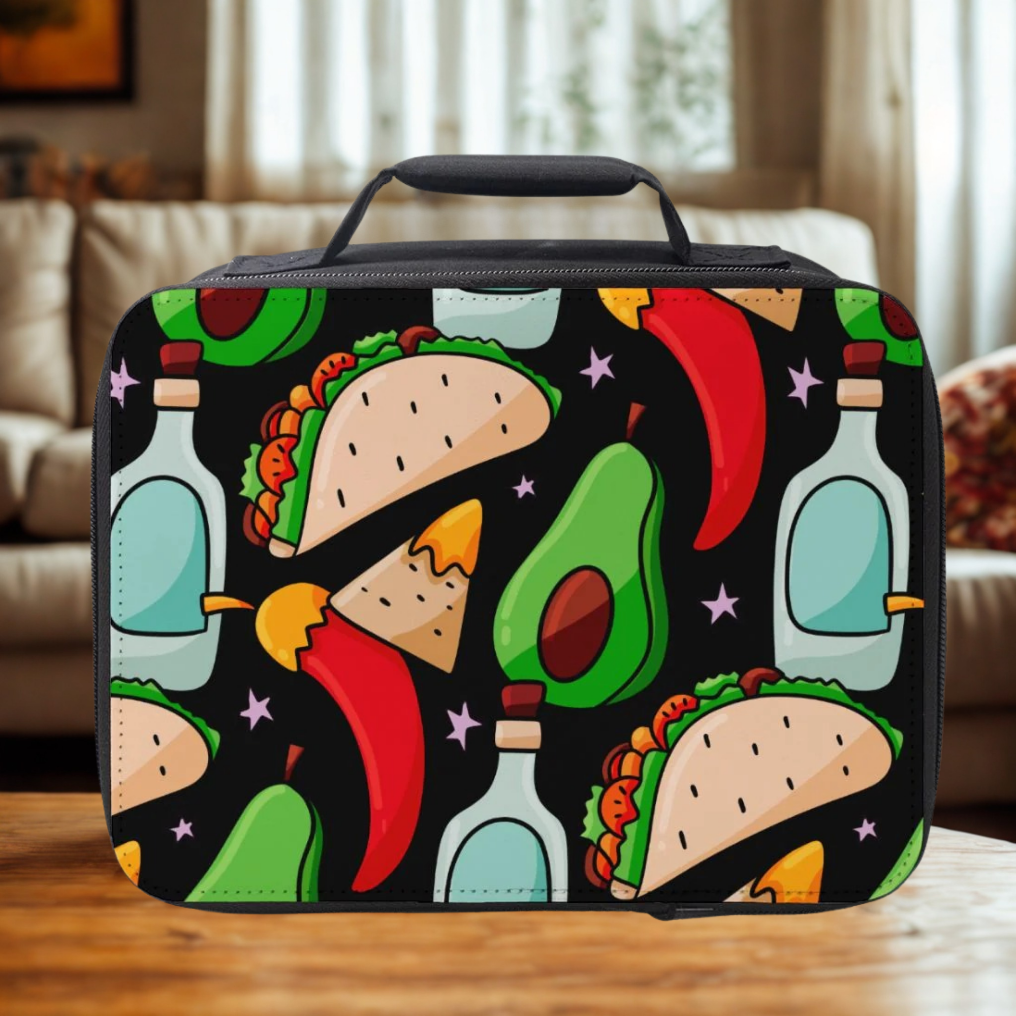  insulated lunch bag with colorful taco and avocado pattern on a wooden table in a living room.