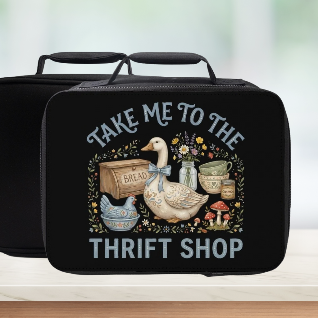 Black lunch bag with a goose design and text 'Take me to the thrift shop' on a light background