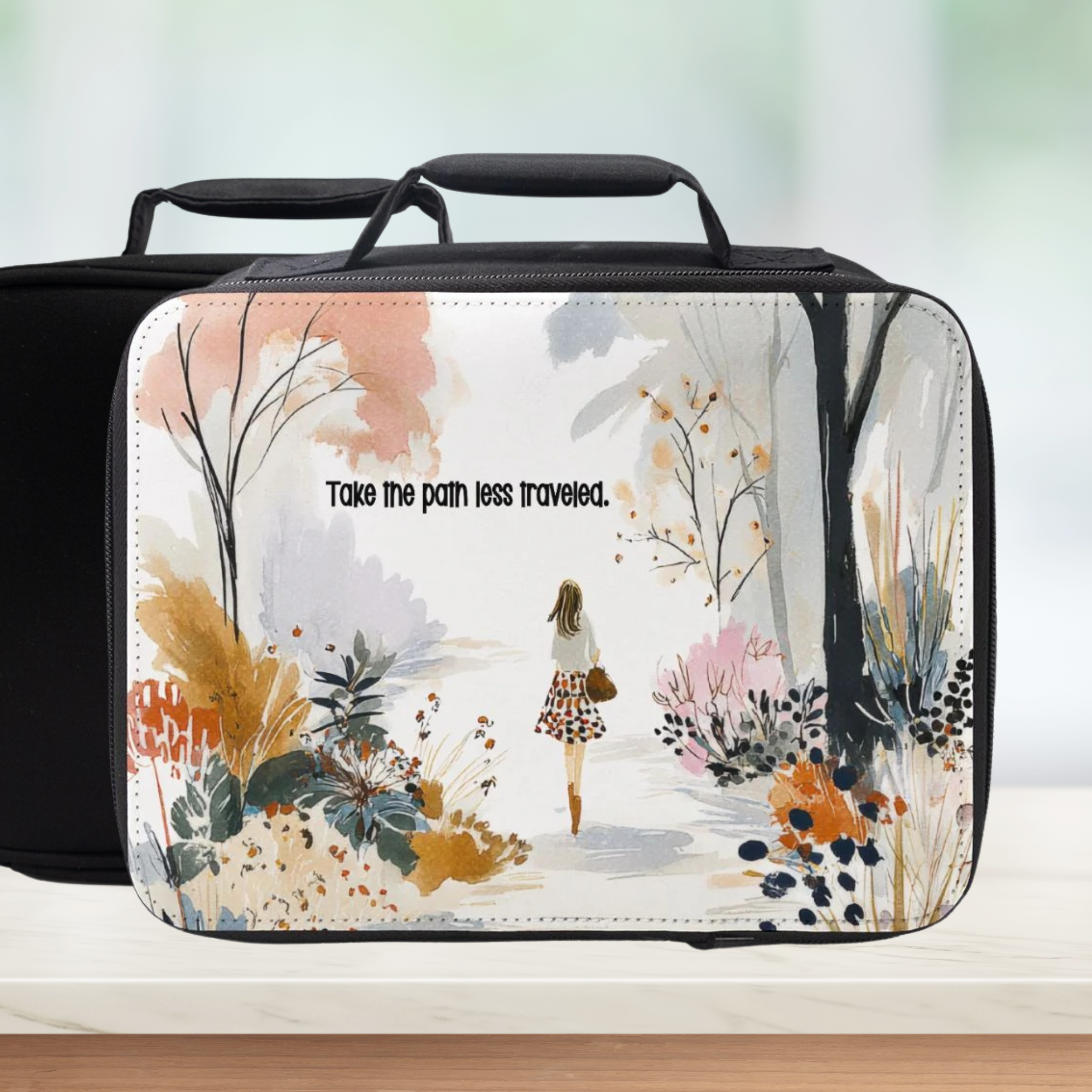 Lunch bag with nature-themed design and motivational quote on a blurred background