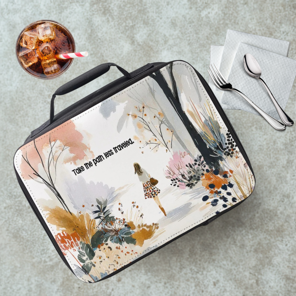Floral-patterned lunch bag with a design of a person walking and text on a gray surface with a drink and utensils.
