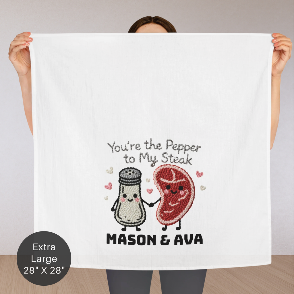 Person holding a towel with cartoon salt and pepper shakers and text 'You're the Pepper to My Steak Mason & Ava' on a plain background.