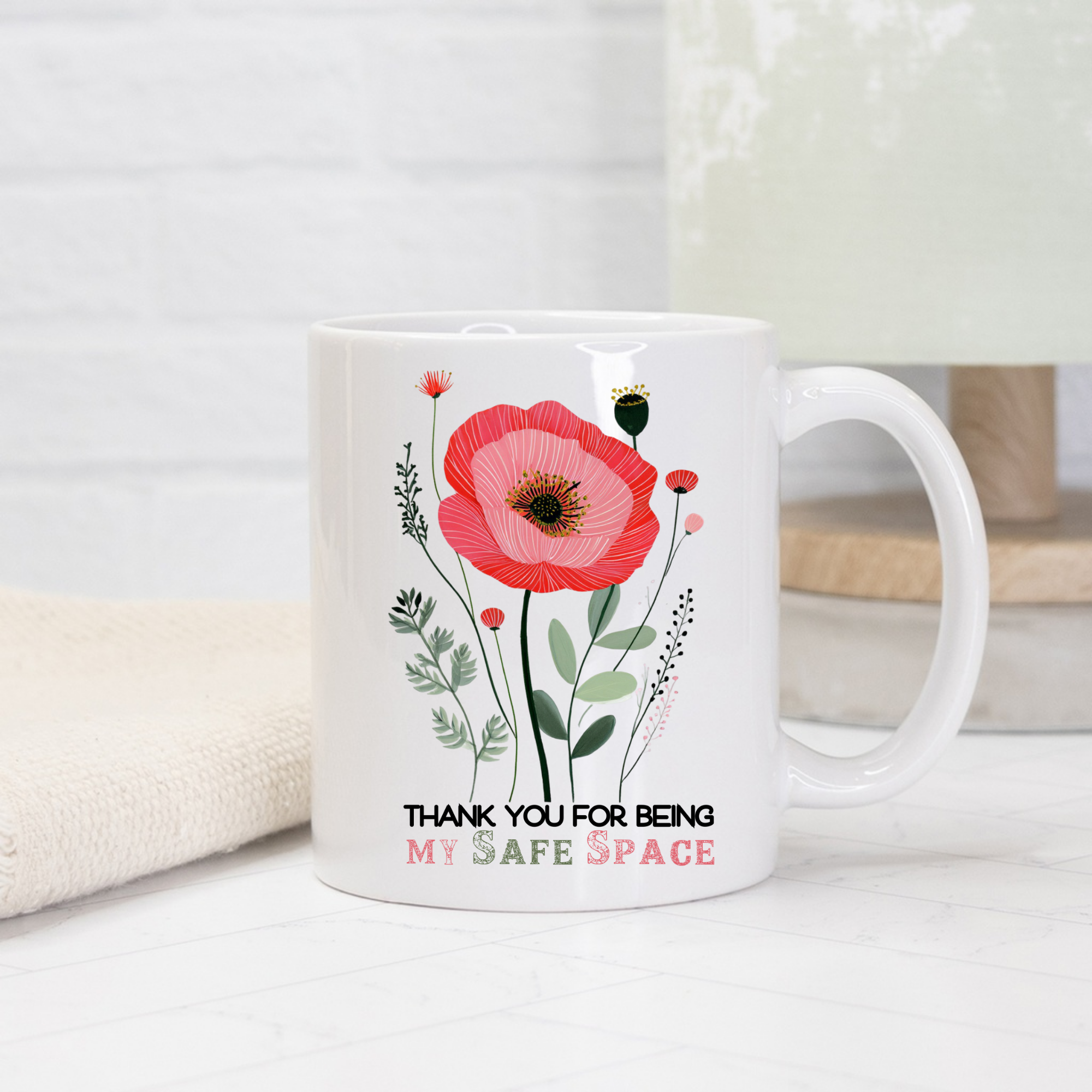 White 11oz mug with a red flower design and text on a white background 