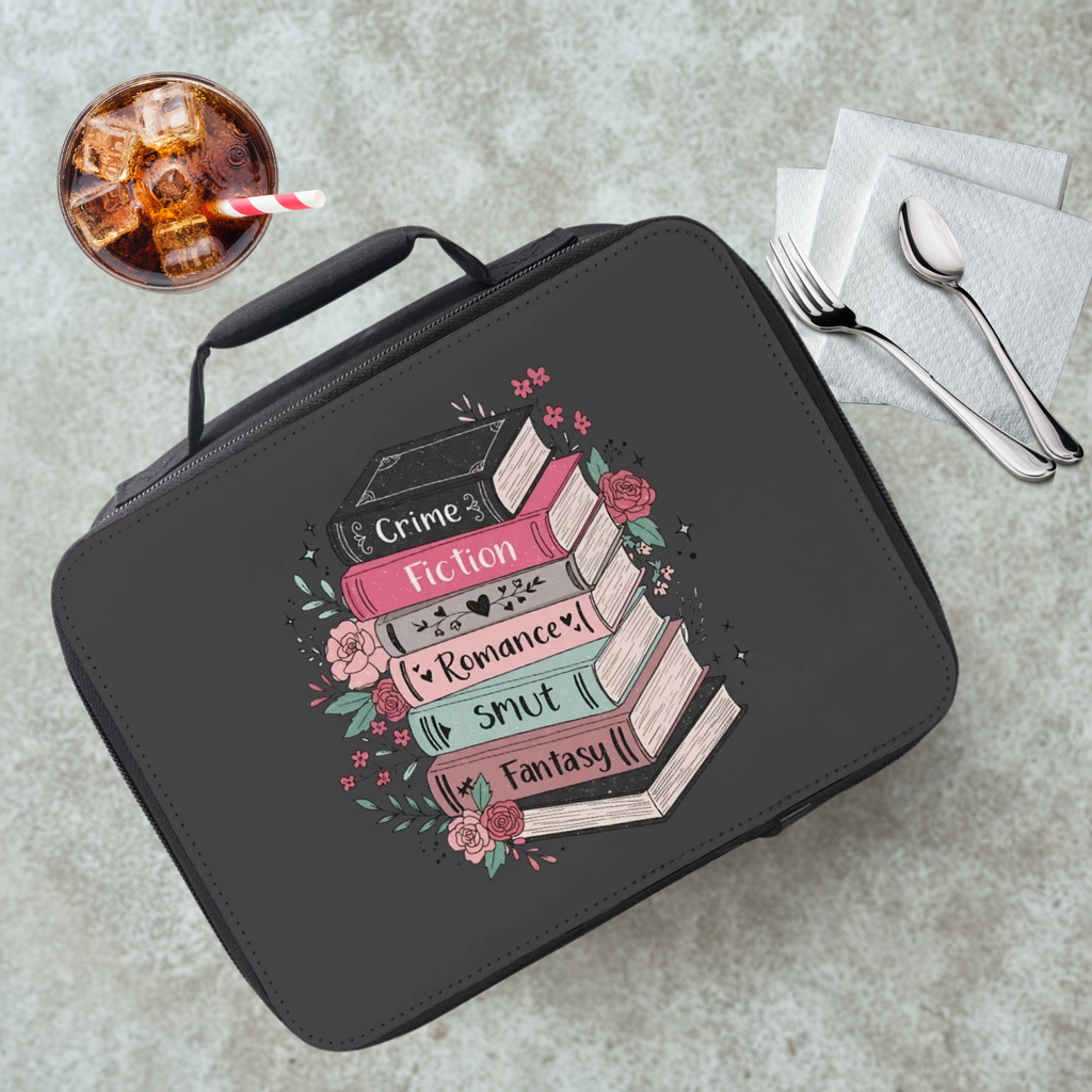 Black lunch bag with book design and text on a gray cafeteria table with a drink and utensils.