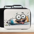 Black and white lunch bag with a cartoon character design on a blurred background