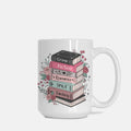 White mug with book-themed design on a white background
