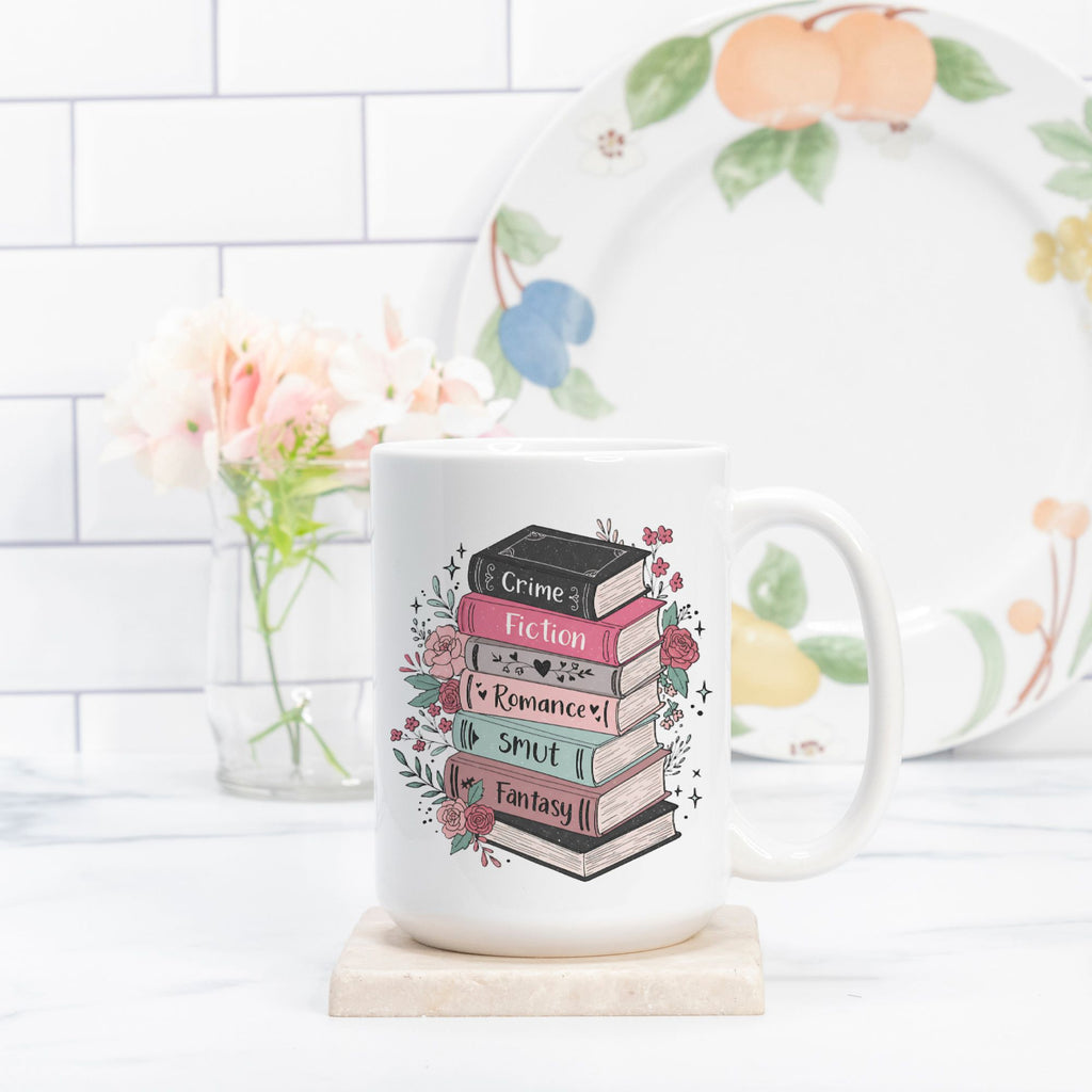 Mug with book design and floral elements on a kitchen counter.