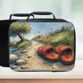 Black lunch bag with a scenic design of red shoes on a path and tree