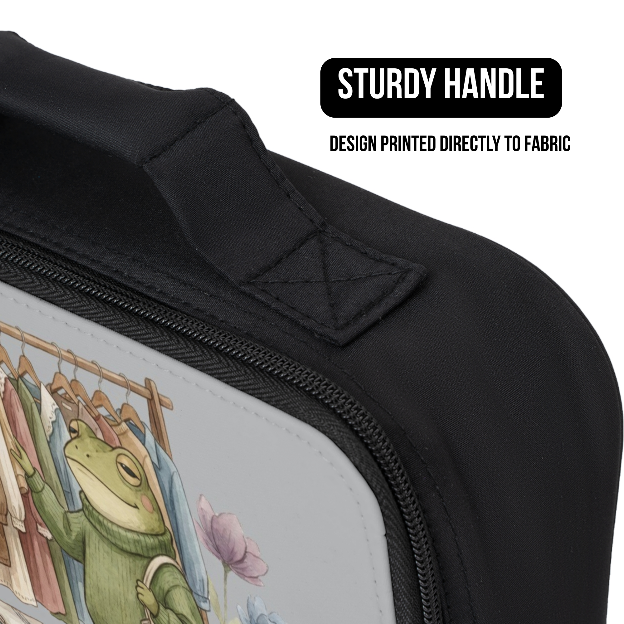 Black lunch bag with a frog design on fabric, featuring a sturdy handle.