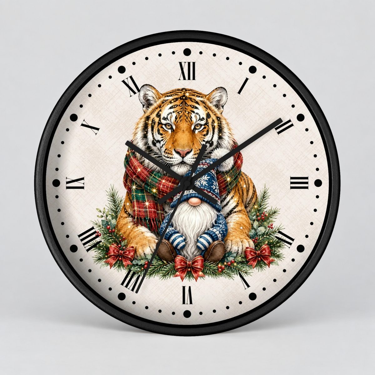 Round wall clock with a black frame and Roman numerals, featuring a festive illustration of a tiger wrapped in a red plaid scarf, a small white-bearded gnome, and holiday greenery on a light background.