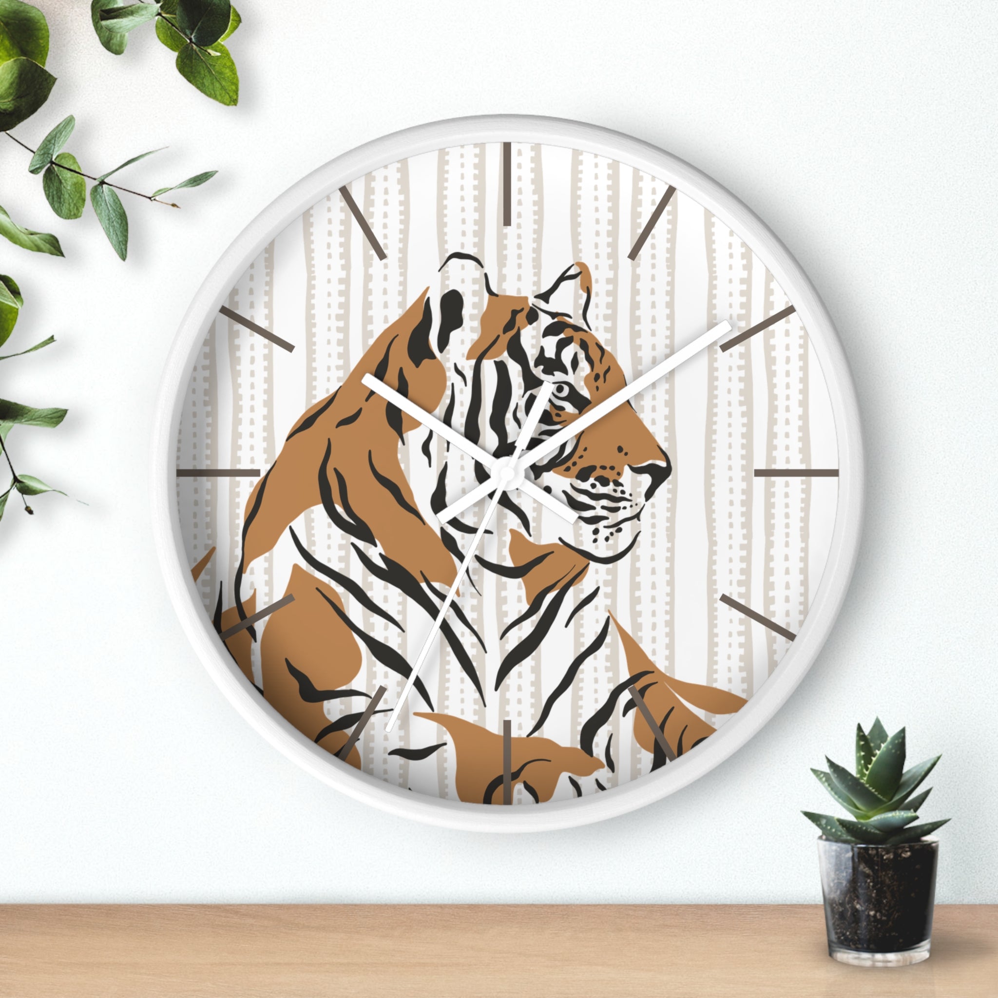 Wall clock with a tiger design on a white background