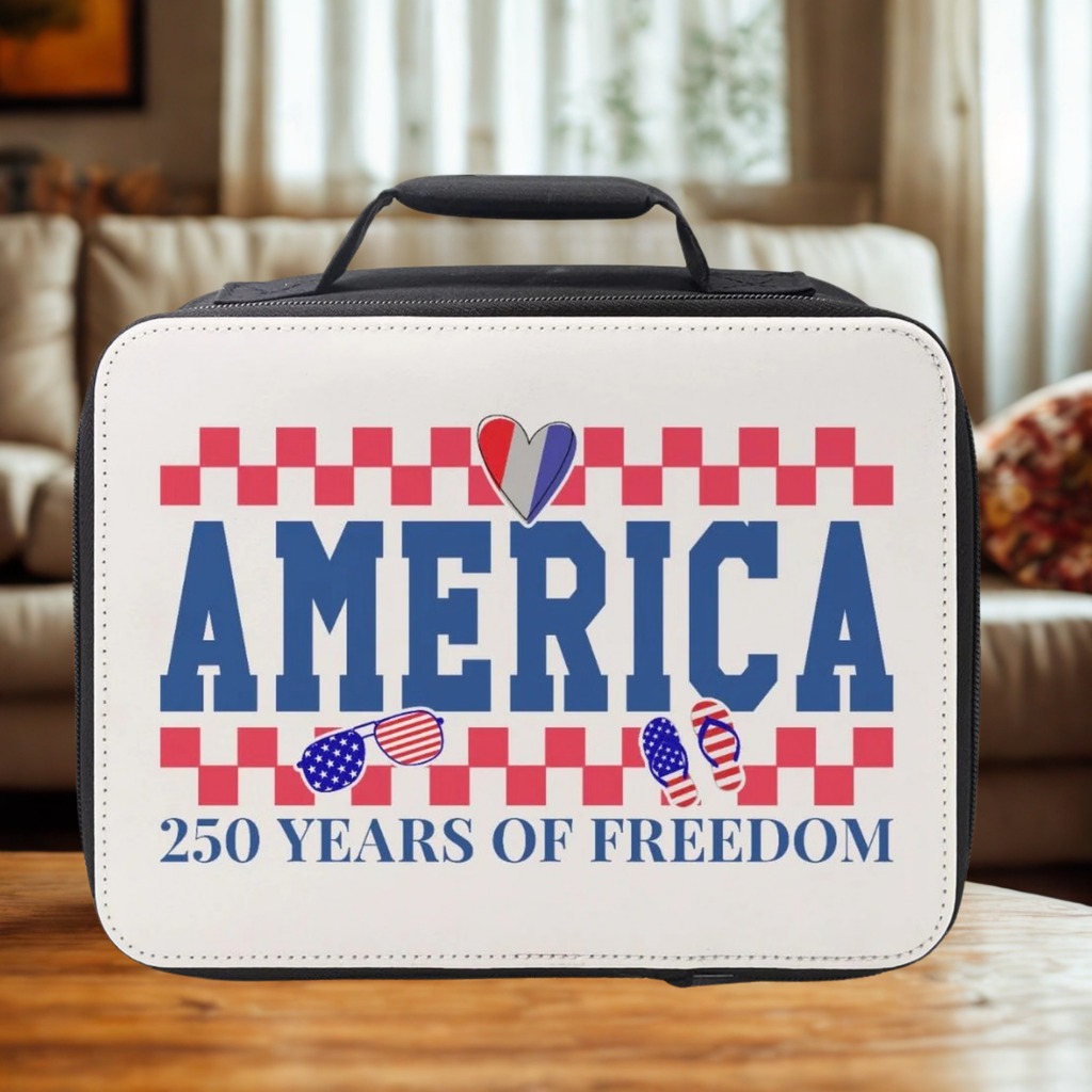Lunch bag with 'America 250 Years of Freedom' design on a wooden coffee table in a cozy living room.