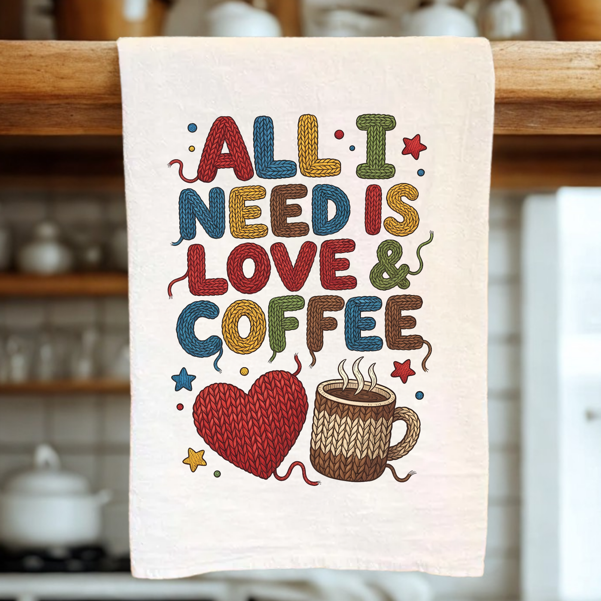 Kitchen towel with colorful text 'All I Need is Love & Coffee' and heart, mug illustration.